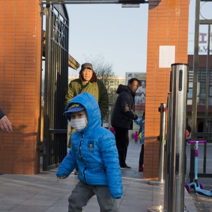 A child arrives to attend the RYB kindergarten in Beijing, China.