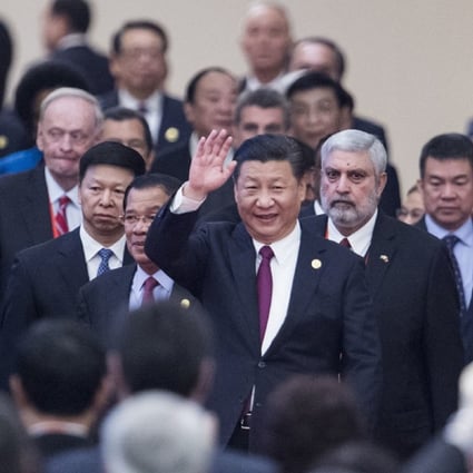 Chinese President Xi Jinping (centre) arrives with leaders at the opening ceremony of the international conference in Beijing on Friday. Photo: AP