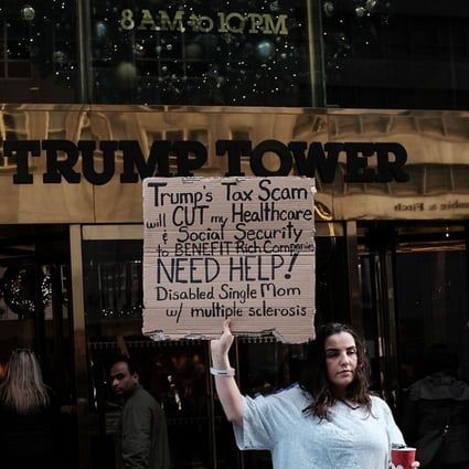 Rosary Solimanto, who has multiple sclerosis and fears for her finances, holds a protest outside Trump Tower over the Republican administration's proposed tax cut which many economists predict will benefit the wealthy at the expense of the poor and middle class. Photo: AFP