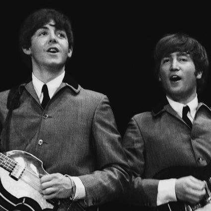 John Lennon (right) performs with Pail McCartney during the Beatles’ first US concert, on February 11, 1964. Picture: AP