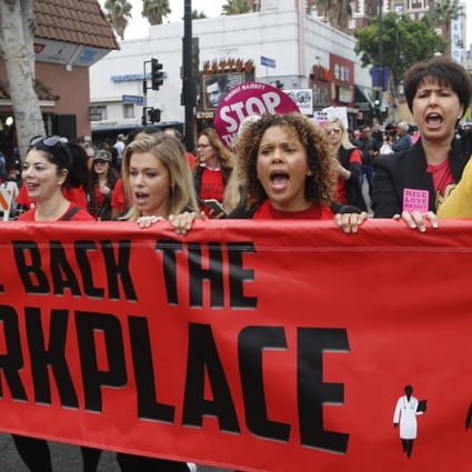 Women march against sexual assault and harassment at a #MeToo rally in Los Angeles on November 12. Photo: AP
