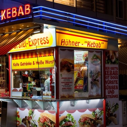 A wurst stand offers hot dogs and kebab in Vienna, Austria. A tax on meat to curb emissions contributing to global warming may be coming. Photo: EPA-EFE