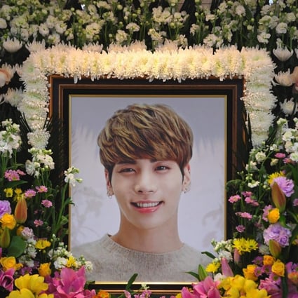 The portrait of Jonghyun, the 27-year-old lead singer of the massively popular K-pop boy band SHINee, is seen on a mourning altar at a hospital in Seoul. Photo: AFP
