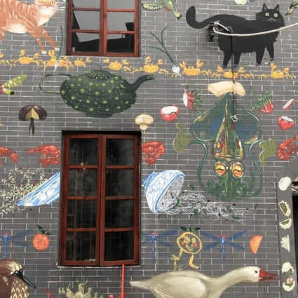 A mural covers a restored building in Nantou’s old town, the focus of the Shenzhen half of the 10th Bi-city Biennale of Urbanism/Architecture. Photo: Enid Tsui