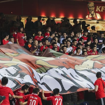 Fans hold a banner reading “We Stand Together” during the Asian Cup  qualifier against Lebanon at Hong Kong Stadium. Photo: K. Y. Cheng