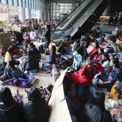 Domestic helpers during a weekend gathering on a street in Central. Photo: Dickson Lee