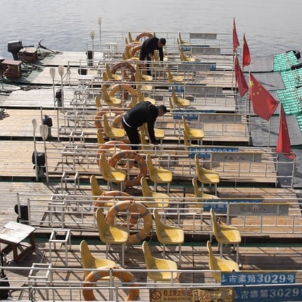 Boatmen prepare rafts for tourists who want to get a closer look at the neighbouring country along the Yalu river between North Korea on the left and China on the right. Photo: AP