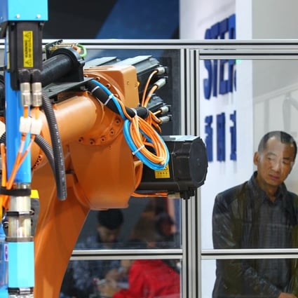 A man looks at an exhibit at last year’s World Robot Conference in Beijing. Photo: Simon Song