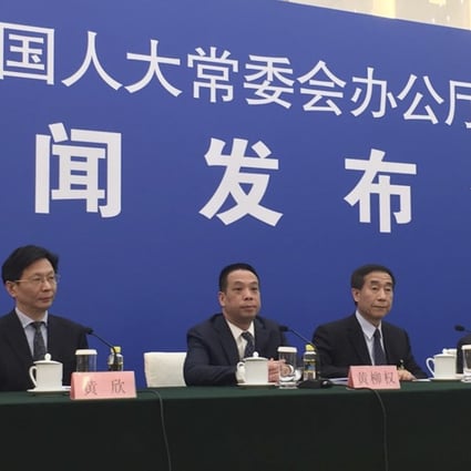 Li Fei (fourth from left), held a press conference on Wednesday after the NPC Standing Committee’s decision to explain the legal basis for the co-location arrangement. Photo: Phila Siu