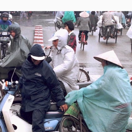 A cyclist skids into a motorbike at a busy intersection in central Hanoi. Vietnam claims that its actions to prevent traffic accidents in increasingly chaotic cities has begun to pay off, with the number of fatalities dropping sharply. Photo: Reuters