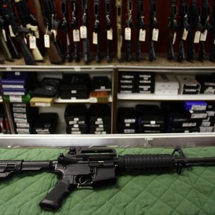 An AR-15 semi-automatic rifle, a shotgun and a handgun, as well as a large quantity of ammunition were found in the Hyatt room of the man arrested. Photo: AFP