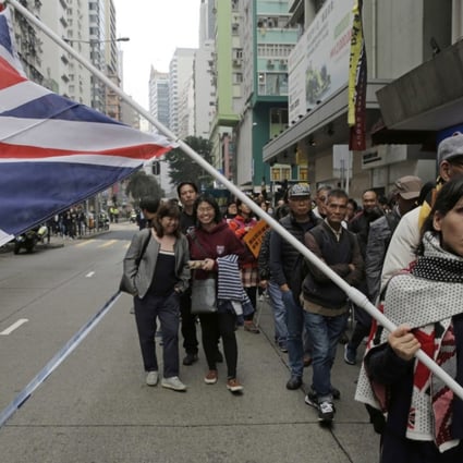 A protester at the New Year’s Day march in Hong Kong shows where her loyalties lie. Photo: AP