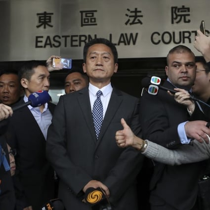 Retired police superintendent Frankly Chu King-wai (centre) leaves the Eastern Court after sentencing. Photo: Winson Wong