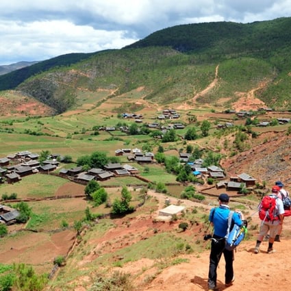 Trekking to a traditional farm stay in the remote village of Xishan, in China’s Yunnan province. Picture: Adrian Bottomley