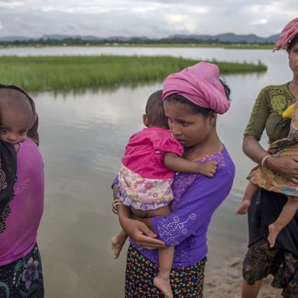 Rohingya Muslim women holding their children. Photo: AP