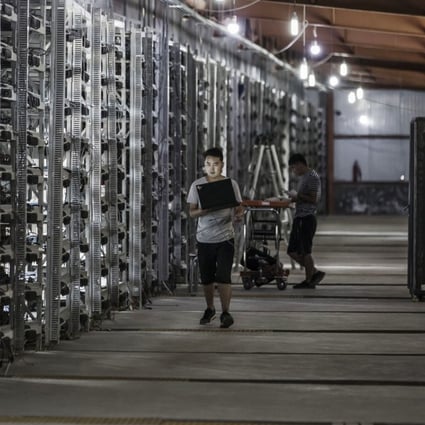 Technicians inspect bitcoin mining machines at a mining facility operated by Bitmain Technologies in Ordos, Inner Mongolia on August 11, 2017. Bitcoin is showing no signs of slowing down, the price of the largest cryptocurrency by market value is soaring as it gains greater mainstream attention despite warnings of a bubble in what not everyone agrees is an asset. Our editors select the best archive images on Bitcoin. Photo: Bloomberg