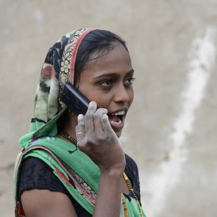 An Indian woman speaks on a mobile phone in Suraj village in Mehsana district, India. Transsion targeted untapped rural markets in the country. Photo: AFP