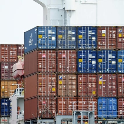 A container is loaded onto a cargo ship at the Tianjin port in China. The US government owes China US$1.2 trillion. Photo: AP