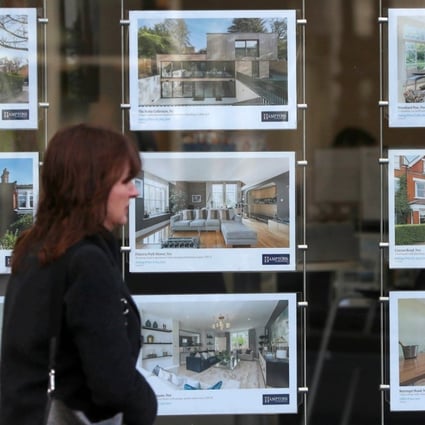 A property agent’s window in London. Asking prices for London homes fell by most since 2009 in January. Photo: EPA