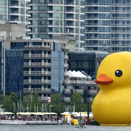 A 19-metre-tall rubber duck floats in Toronto Harbour. The city’s property sales market has cooled over the past seven months, but the average price of a home is still C$735,021. Photo: EPA