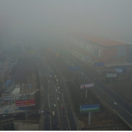Buildings and roads are shrouded in smog in the city of Sanhe, Hebei province on January 5. Photo: EPA