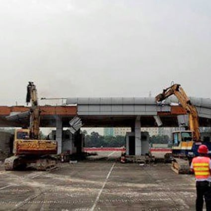 Heavy machinery pull apart the Tongle checkpoint to the Shenzhen Special Economic Zone. Photo: Handout