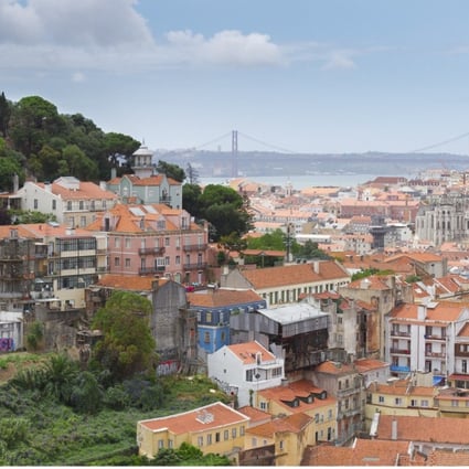 A view over the Portuguese capital of Lisbon. The country’s unemployment rate is falling and its offer of residency for investment has attracted money from overseas, pulling away from the depths of its economic crisis and presenting opportunities for investors. Photo: Alamy