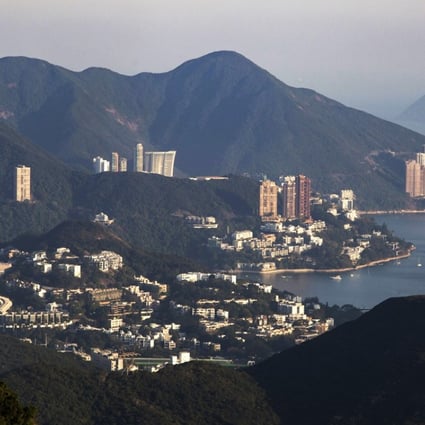 Residential buildings stand in the Deep Water Bay and Repulse Bay areas. Cheap money is the single most important cause of the asset bubbles affecting real estate in many cities, and stock prices globally. Photo: Bloomberg