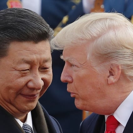 US President Donald Trump (right) chats with Chinese President Xi Jinping during a welcome ceremony at the Great Hall of the People in Beijing. Photo: AP