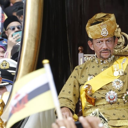 Brunei's Sultan Hassanal Bolkiah waves to well-wishers during a procession as part of the Golden Jubilee celebrations in Bandar Seri Begawan, Brunei in 2017. File photo: EPA