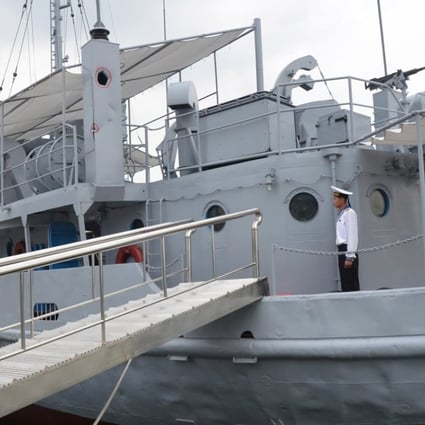 A North Korean seaman aboard the USS Pueblo, a US Navy ship captured by North Korea in 1968 and now moored in Pyongyang and serving as a museum and symbol of North Korean military might. Picture: AFP