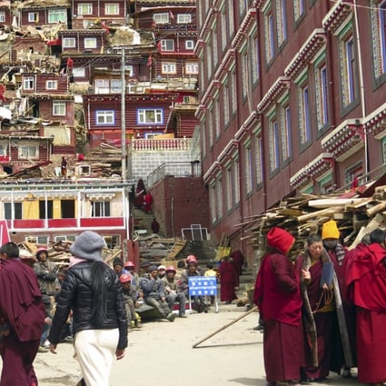 Eight months of demolition and expulsion has reduced the size of Larung Gar, a sprawling Buddhist centre of learning and prayer in the mountains of Sichuan. Photo: AP