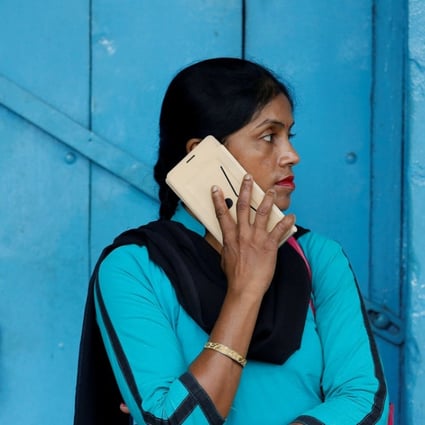 A woman talks on her mobile phone in Kolkata, India. Chinese smartphone makers now dominate the fast-growing market. Photo: Reuters
