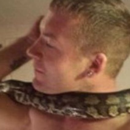 Dan Brandon (pictured with one of his many snakes) was killed by his pet python ‘Tiny’, a coroner ruled. Brandon, of Hampshire, England, had owned the snake since it was a baby. Photo: Facebook