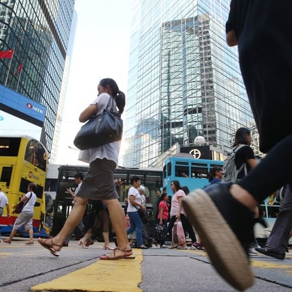 Pedestrians walking in Central on Hong Kong island. Photo: K. Y. Cheng