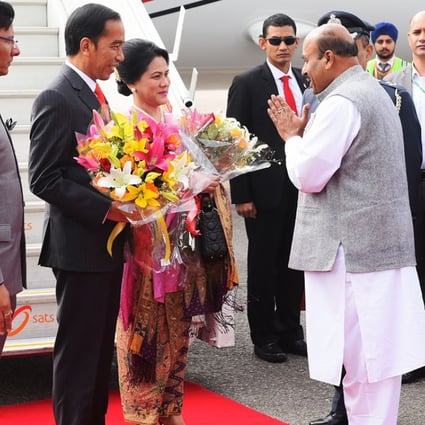 Indonesian President Joko Widodo, second from left, arrives with his wife Iriana to participate in the Asean-India Commemorative Summit in New Delhi. Photo: AFP