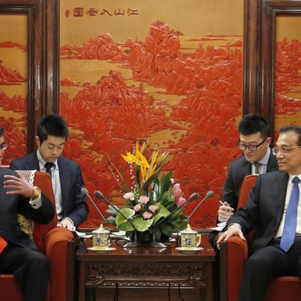 Japanese Foreign Minister Taro Kono (left) and Chinese Premier Li Keqiang hold talks at the Zhongnanhai Leadership Compound in Beijing on Sunday. Photo: EPA 