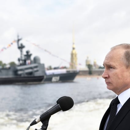 Russian President Vladimir Putin attends a ceremony for Russia's Navy Day in Saint Petersburg on July 30. The pomp-filled display of Russia's naval might celebrated the expansion of Russian sea power from the Baltic Sea to the shores of Syria. Photo: AFP