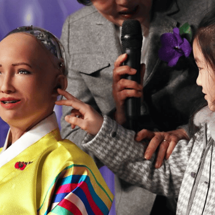 A little girl tries to touch artificial intelligence robot, Sophia, in Korean traditional costume, during a conference on the Fourth Industrial Revolution and AI robots held at the Plaza Hotel in downtown Seoul, Tuesday. Photo: Yonhap