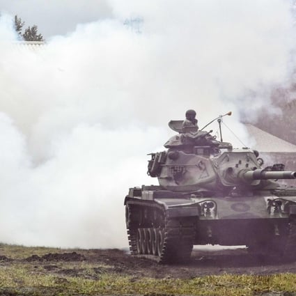 A Taiwanese tank crew takes part in an annual drill at a military base in the eastern city of Hualien on Tuesday. Photo: AFP