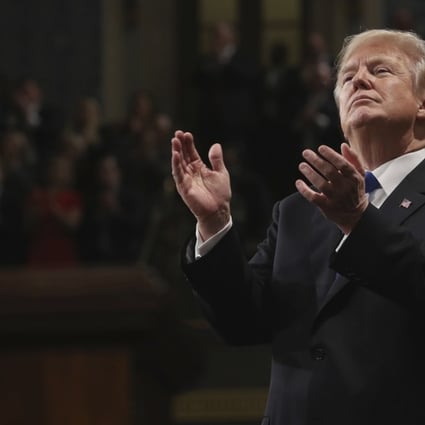 US President Donald Trump claps at his first State of the Union address in the House chamber of the US Capitol to a joint session of Congress on Tuesday. Photo: AP