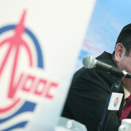 Yuan Guangyu, CEO of China National Offshore Oil Corp (CNOOC), speaks on the company’s production outlook at a briefing in Hong Kong. Photo: Jonathan Wong