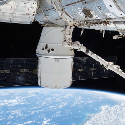 This Nasa photo obtained January 26, 2018 shows the SpaceX Dragon resupply ship with its dual outstretched solar arrays attached to the Harmony module as the International Space Station orbited above Brazil on January 7, 2018. Russia is planning to send space tourists in the coming years. Photo: AFP 