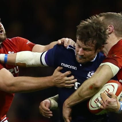 Scotland centre Pete Horne (C) is tackled by Wales’ Tomas Francis (L) and Wales’ centre Hadleigh Parkes during their opening Six Nations loss. Photo: AFP