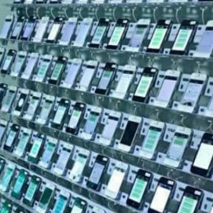 A click farm in Thailand, where scores of mobile phones are strung together to provide digital signatures that mimic the real responses of users. Photo: SCMP/Handout