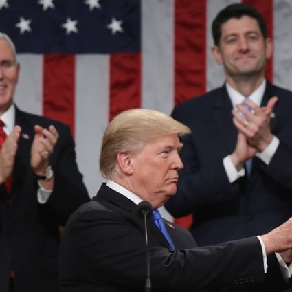 US President Donald Trump delivers his first State of the Union address inside the House Chamber in Washington on January 30 as Vice-President Mike Pence (left) and House Speaker Paul Ryan applaud. Photo: AFP