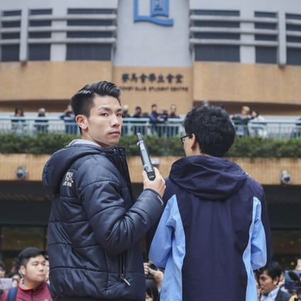 Student union president Lau Tsz-kei (left) and Chinese medicine student Andrew Chan Lok-hang at a protest against Baptist University’s decision to suspend Lau and Chan after a stand-off with staff at the language centre. Photo: Winson Wong