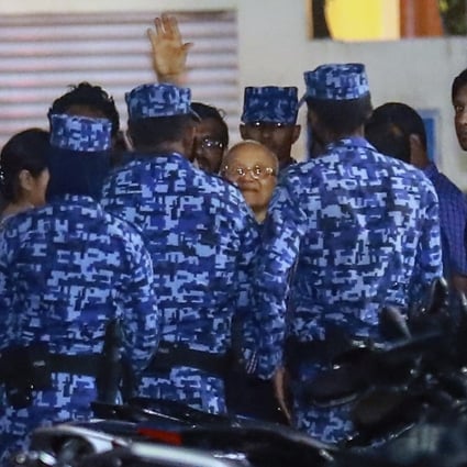 Policemen arrest former Maldives president and opposition leader Maumoon Abdul Gayoom, centre, after the government declared a 15-day state of emergency in Male, Maldives. Photo: AP