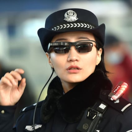 A police officer using the facial recognition glasses. Photo: AFP