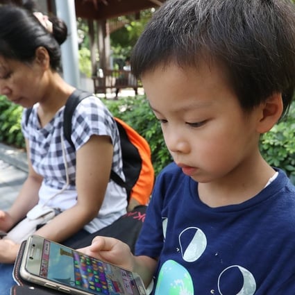 Mobile devices have become “essentials” for children nowadays. Photo: Edward Wong